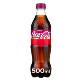 A 500ml bottle of Coca Cola - Cherry features a red label and cap, highlighting its cherry flavor—a refreshing drink choice.